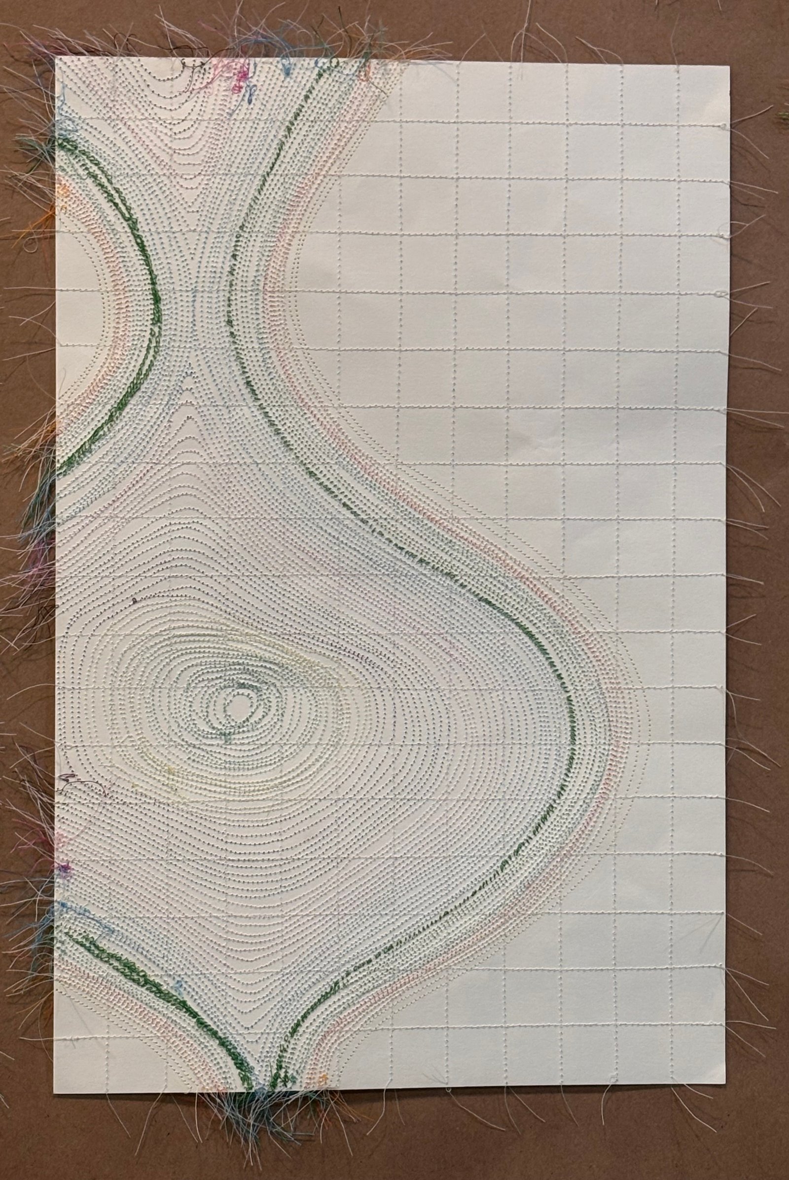 Image is an abstract piece sewn on paper, using orange, green, blue, purple and cream color threads.